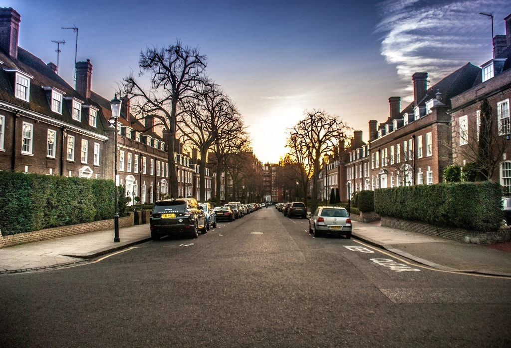 Row of British terraced houses on a quiet street at dusk